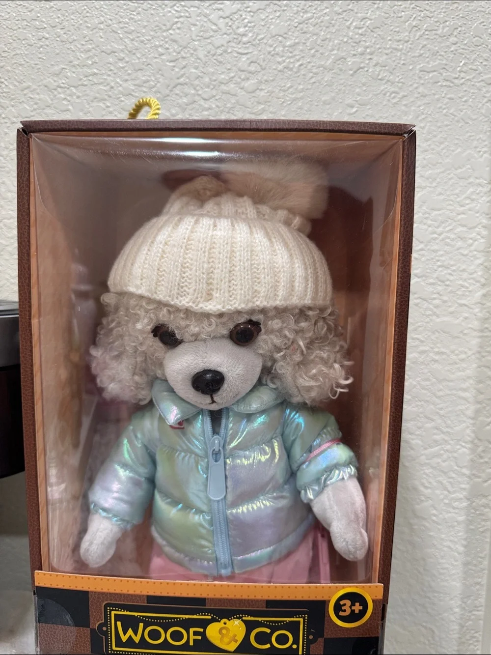 Willow Plush Dog in Iridescent Light Blue Jacket and Cream Knit Hat